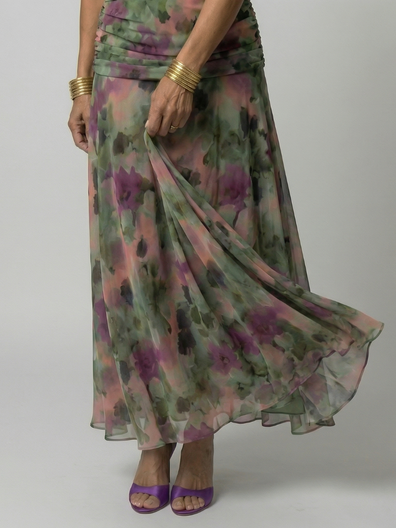 Woman wearing a purple watercolor floral mesh maxi dress with draped crossover neckline and ruched waist - view 13