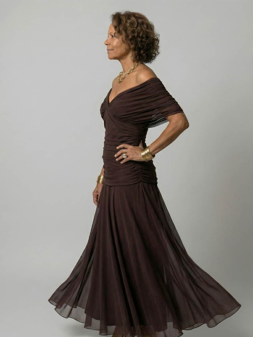Woman wearing a purple watercolor floral mesh maxi dress with draped crossover neckline and ruched waist - view 17