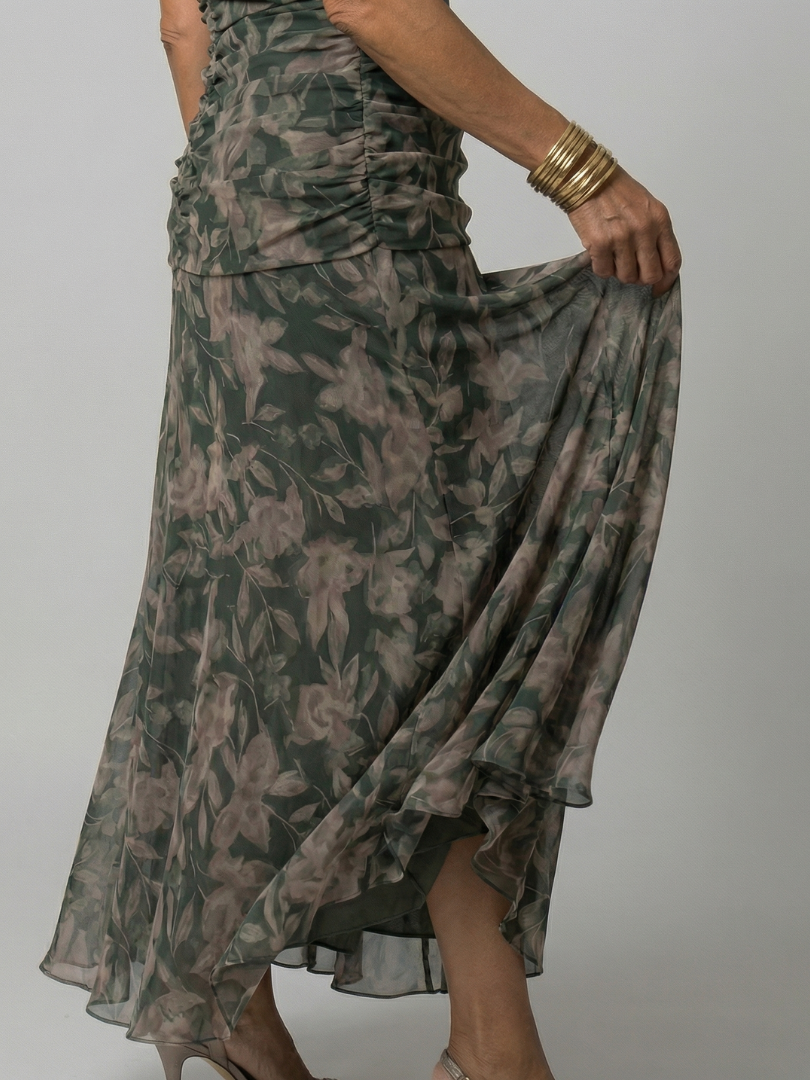 Woman wearing a purple watercolor floral mesh maxi dress with draped crossover neckline and ruched waist - view 6