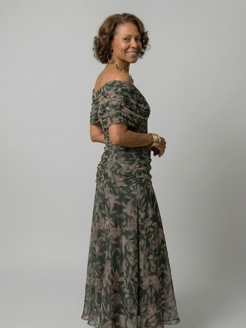 Woman wearing a purple watercolor floral mesh maxi dress with draped crossover neckline and ruched waist - view 7