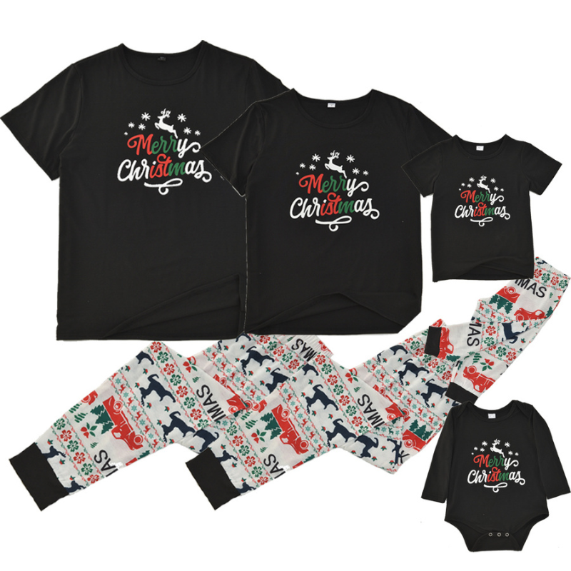 Whole family in black Merry Christmas tees and festive print jogger pajamas beside a Christmas tree - view 6