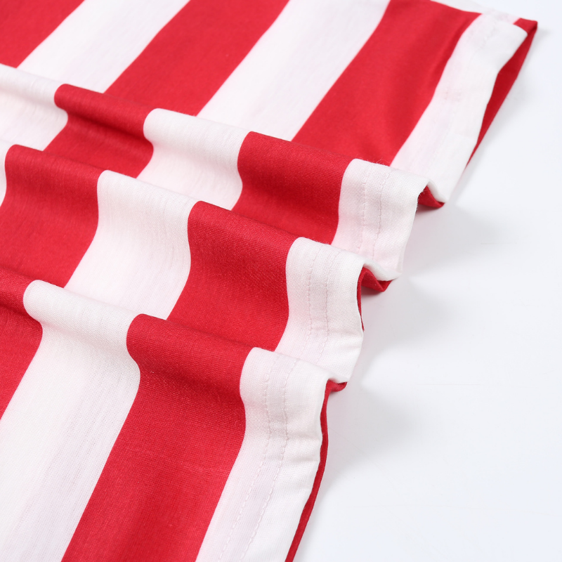 Family wearing matching red and white striped Christmas pajamas with gray cuffs - view 14