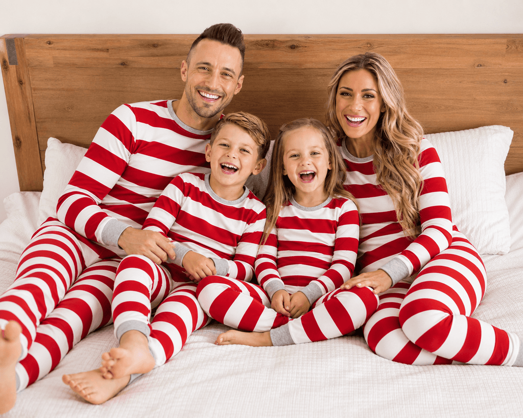 Family wearing matching red and white striped Christmas pajamas with gray cuffs - view 5