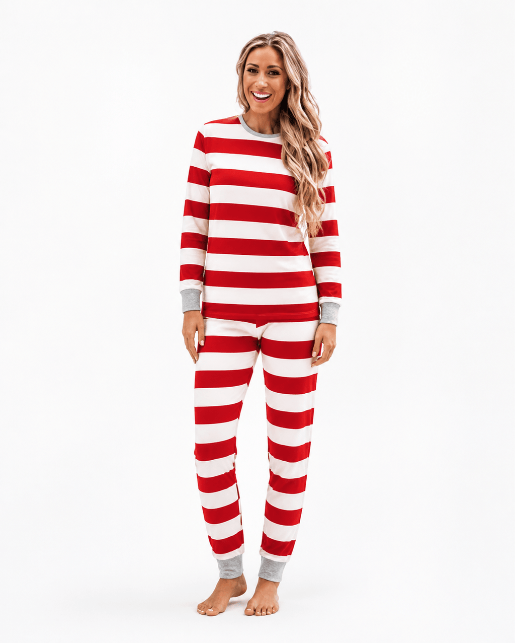 Family wearing matching red and white striped Christmas pajamas with gray cuffs - view 9