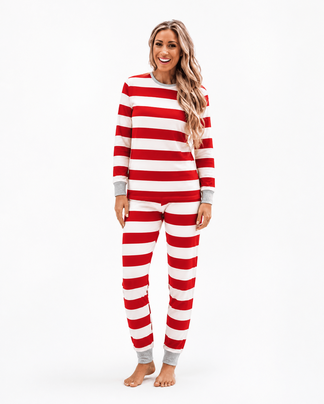 Family wearing matching red and white striped Christmas pajamas with gray cuffs - view 9