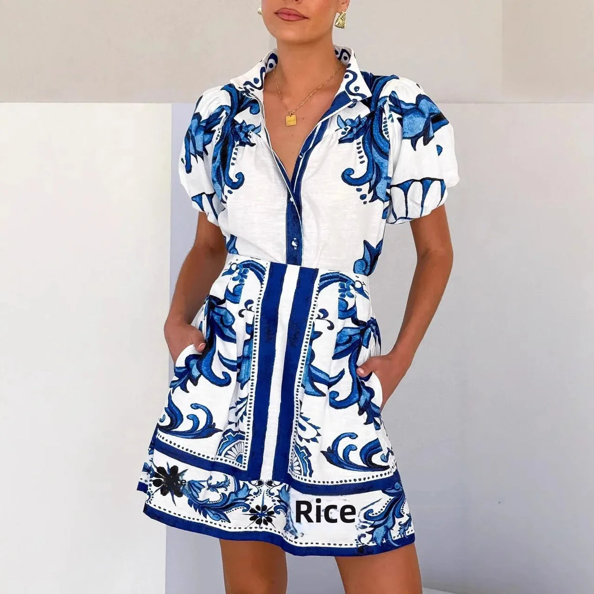 Woman wearing a pink and red tile print puff sleeve cocktail dress with pockets - view 5