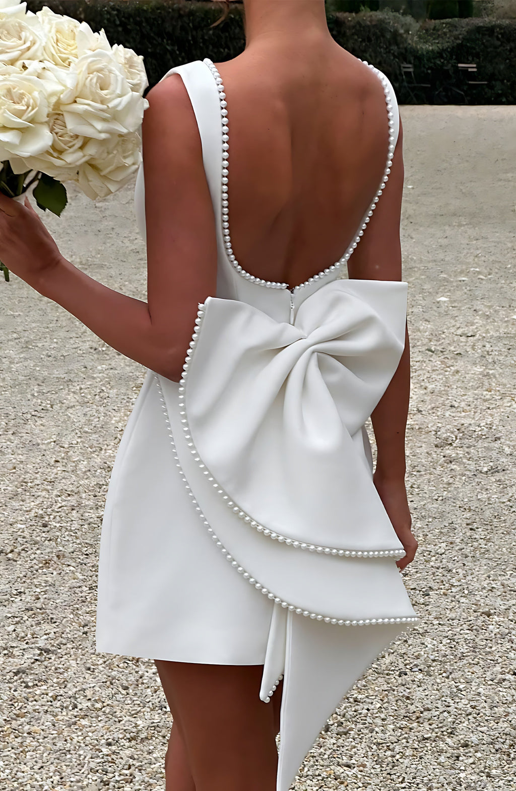 Sleeveless A-line cocktail mini dress with pearl-effect trim and oversized back bow - view 12