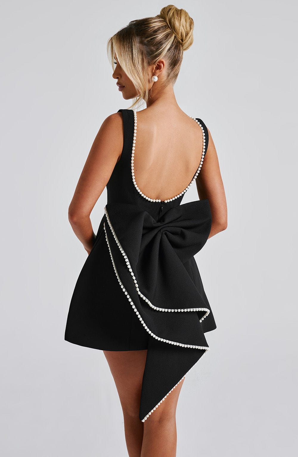 Sleeveless A-line cocktail mini dress with pearl-effect trim and oversized back bow - view 16