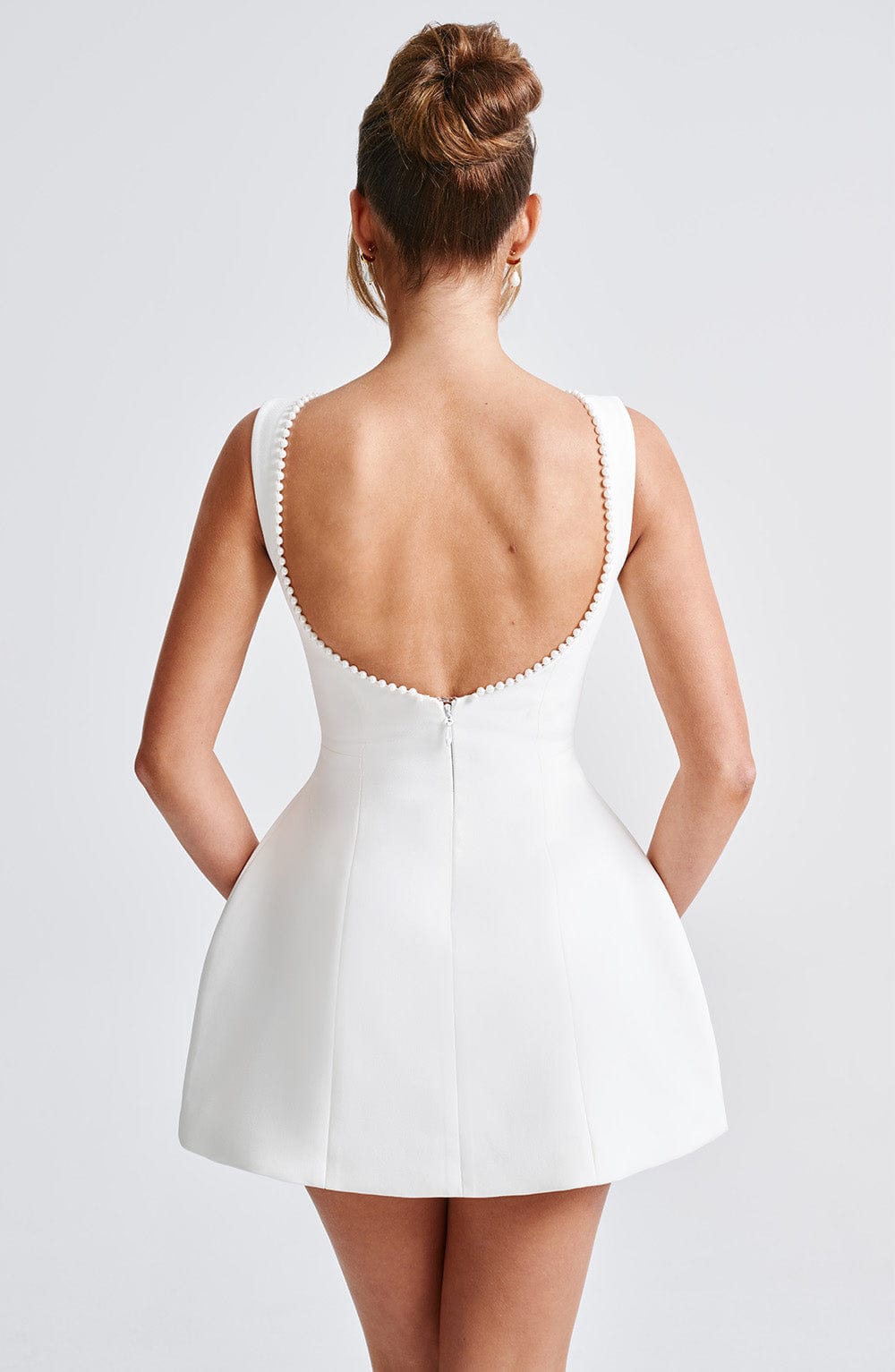 Sleeveless A-line cocktail mini dress with pearl-effect trim and oversized back bow - view 19