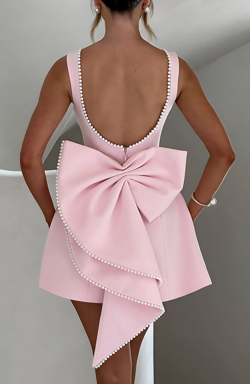 Sleeveless A-line cocktail mini dress with pearl-effect trim and oversized back bow - view 4