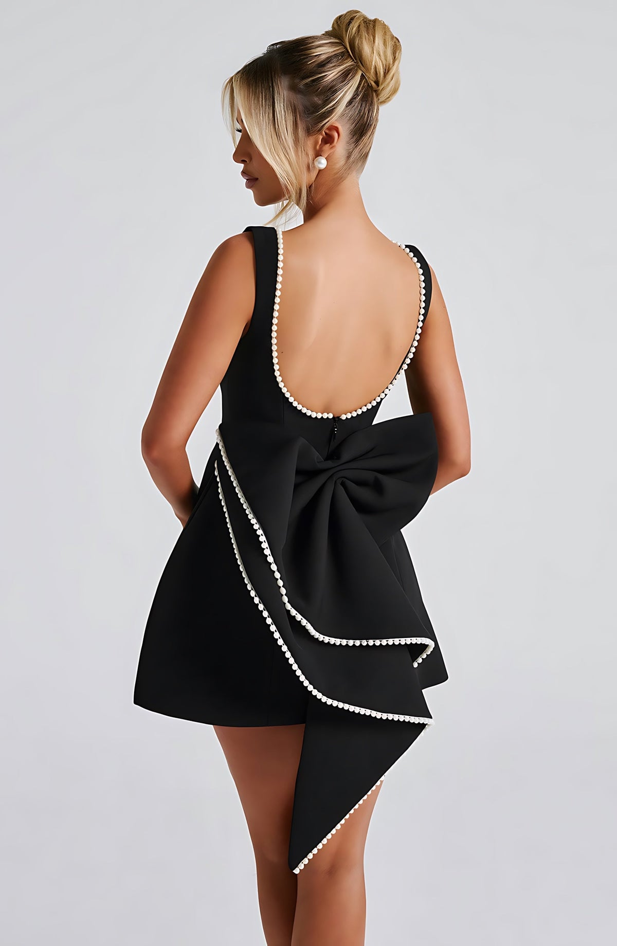 Sleeveless A-line cocktail mini dress with pearl-effect trim and oversized back bow - view 6
