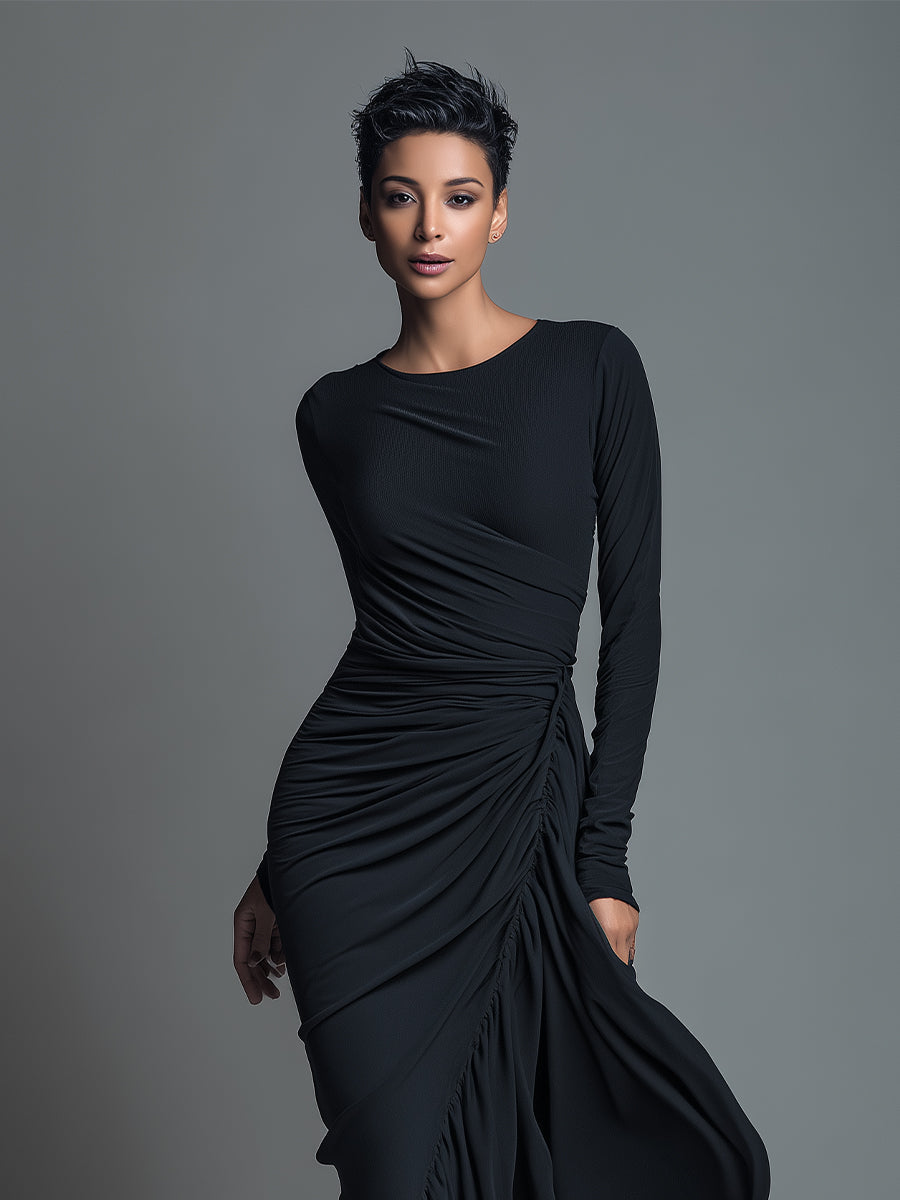 Woman wearing a black long sleeve ruched maxi dress with a draped skirt - view 2