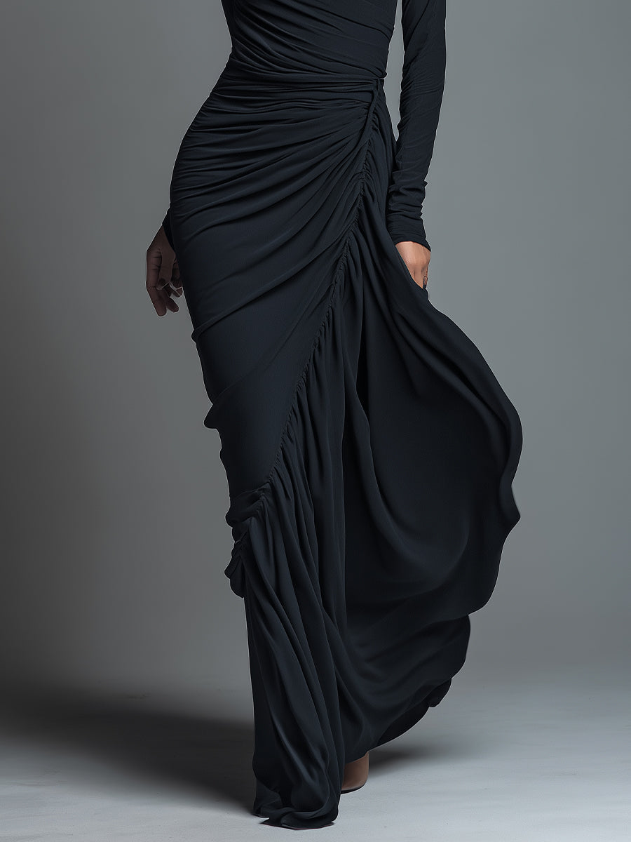 Woman wearing a black long sleeve ruched maxi dress with a draped skirt - view 3