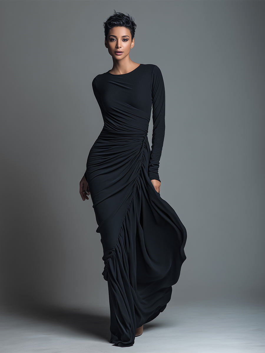 Woman wearing a black long sleeve ruched maxi dress with a draped skirt - view 4