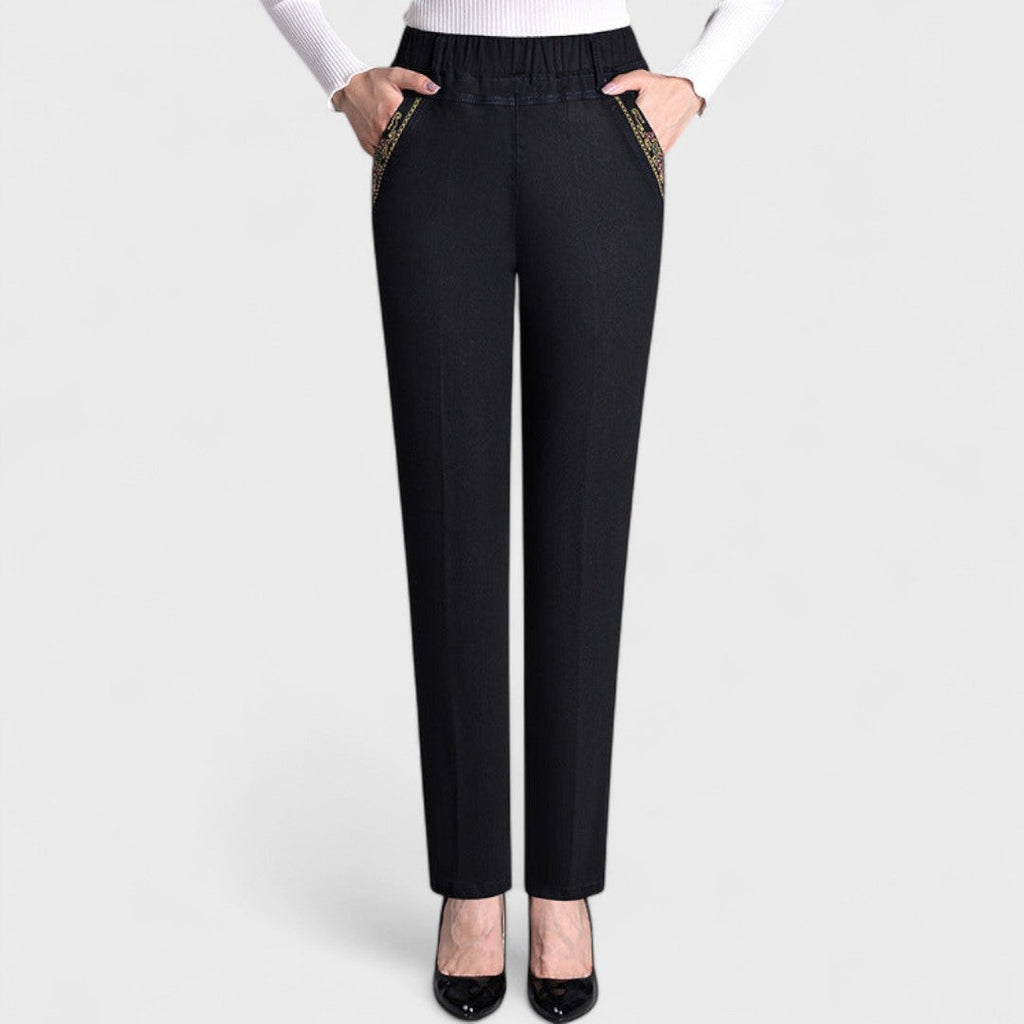 Women's elastic waist straight leg jeans with embroidered side pocket trim and pressed front crease