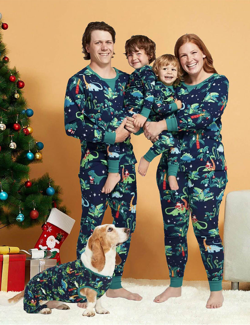 Matching family Christmas pajamas with dinosaur print on navy and teal ribbed cuffs