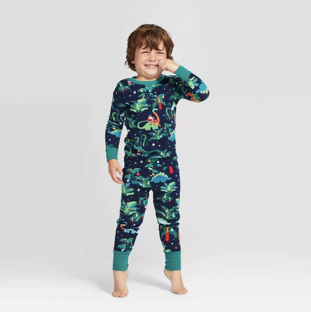 Matching family Christmas pajamas with dinosaur print on navy and teal ribbed cuffs - view 3