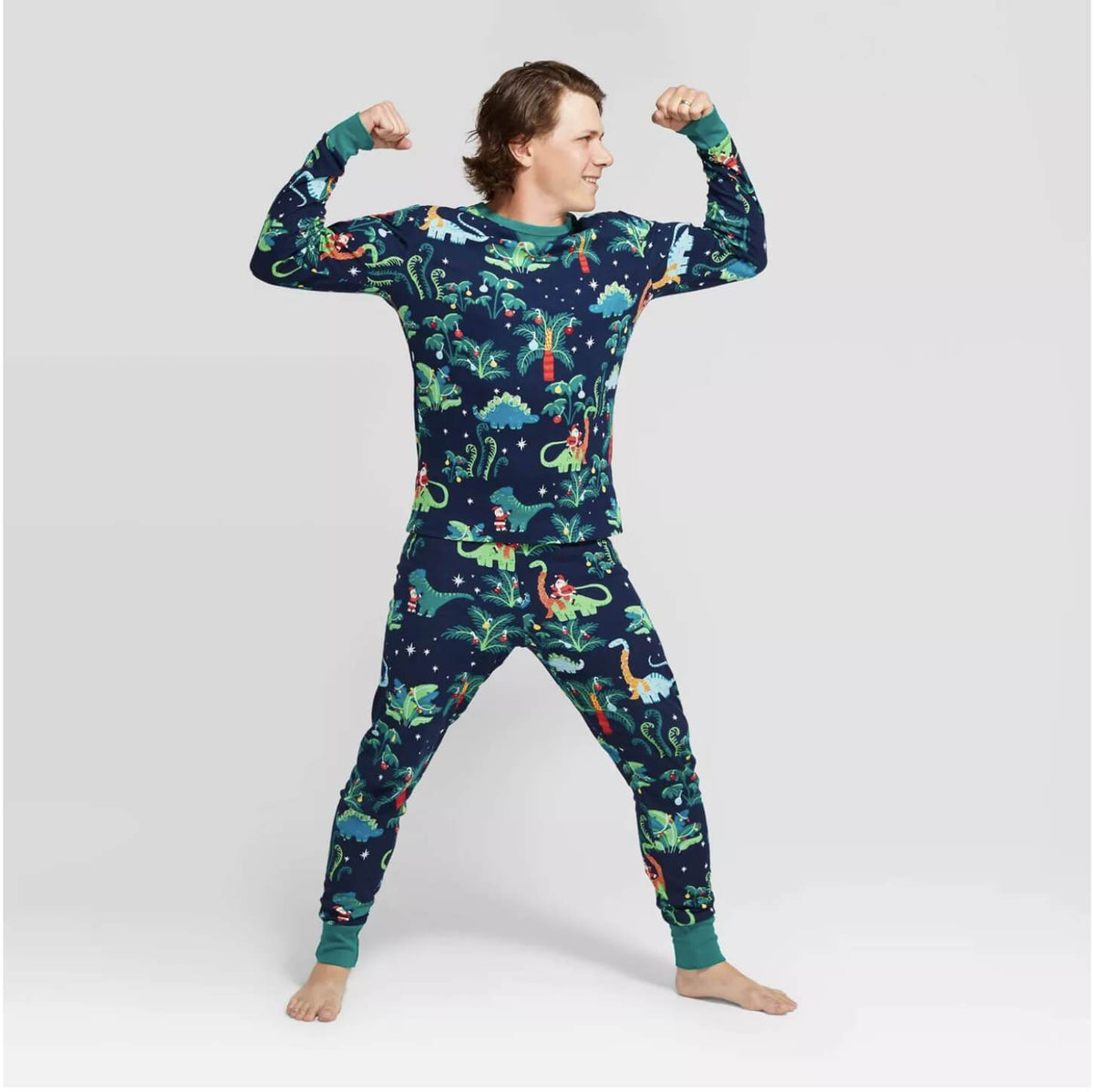 Matching family Christmas pajamas with dinosaur print on navy and teal ribbed cuffs - view 6