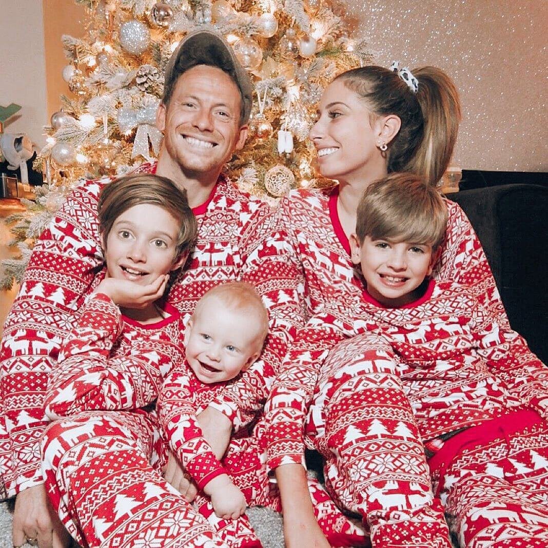 Matching family Christmas pajamas in red and white Fair Isle print with reindeer and snowflakes - view 3