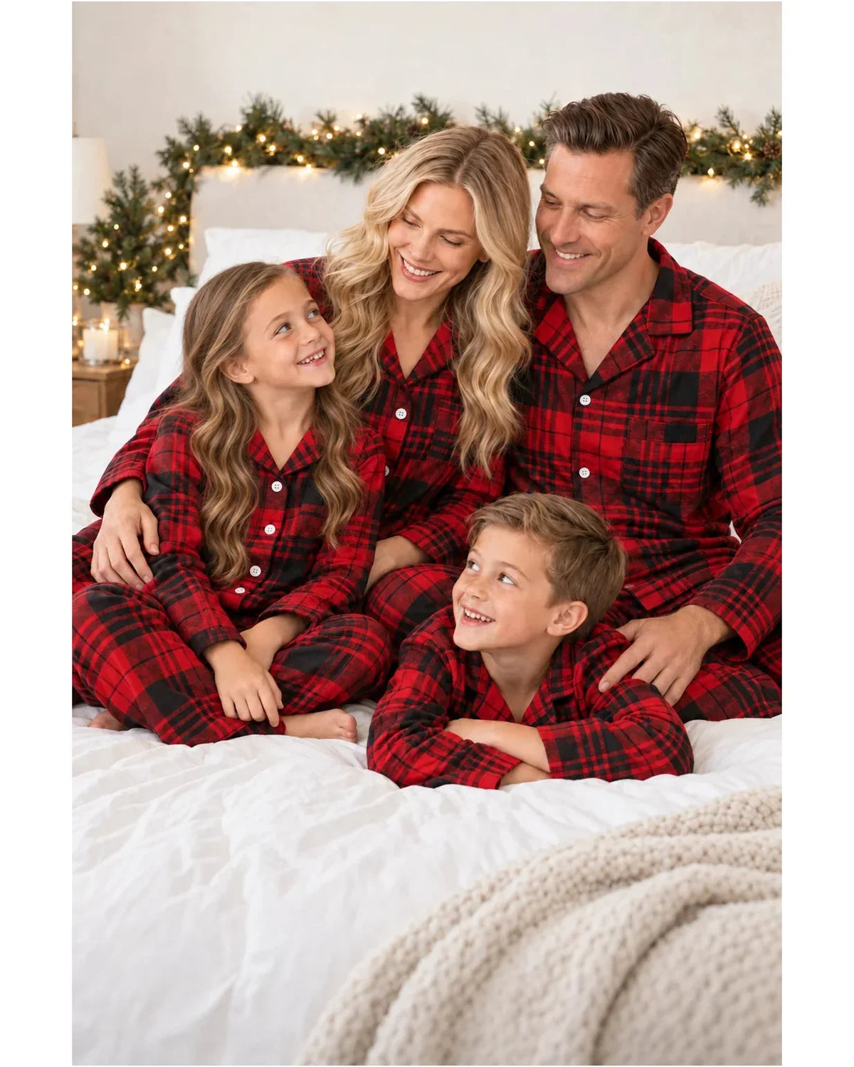 Family wearing matching red and black plaid flannel Christmas pajamas - view 11