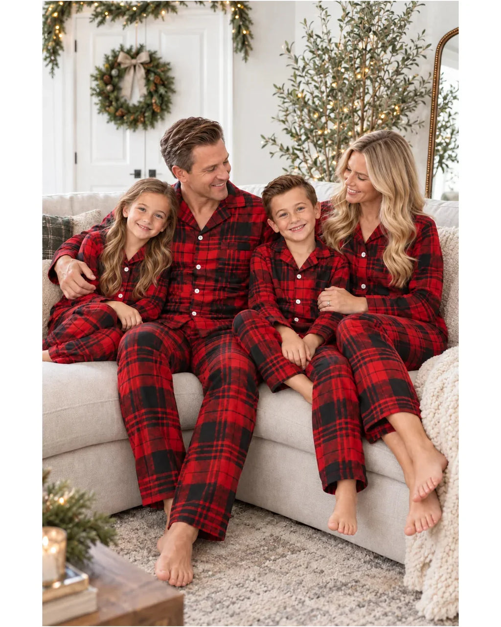 Family wearing matching red and black plaid flannel Christmas pajamas - view 6