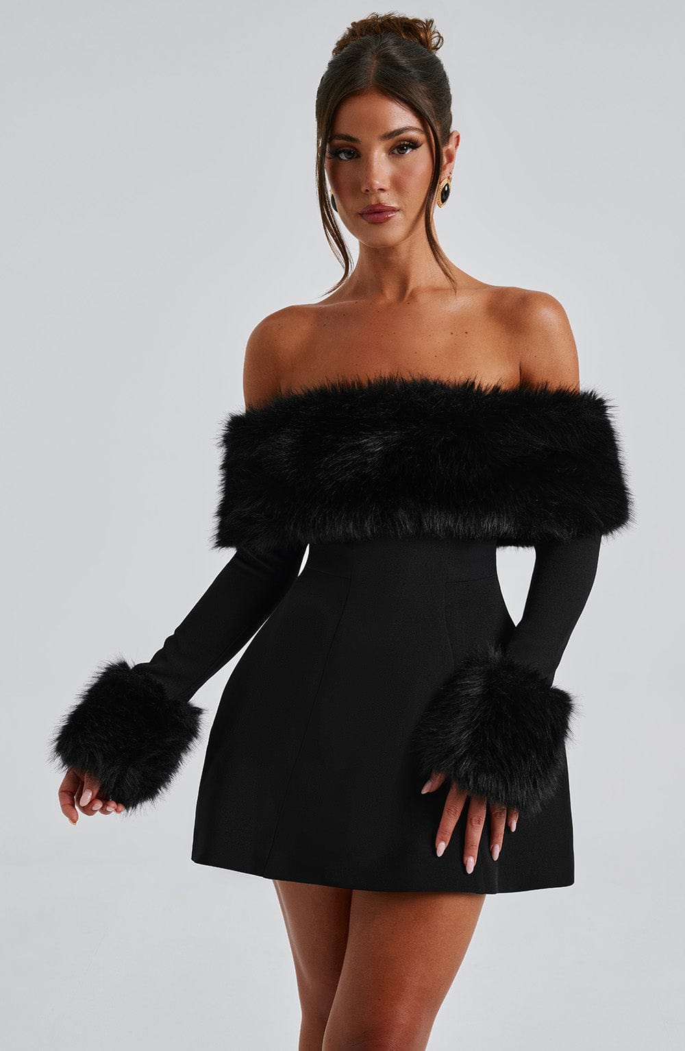 Long sleeve black mini dress with faux fur trim neckline and cuffs