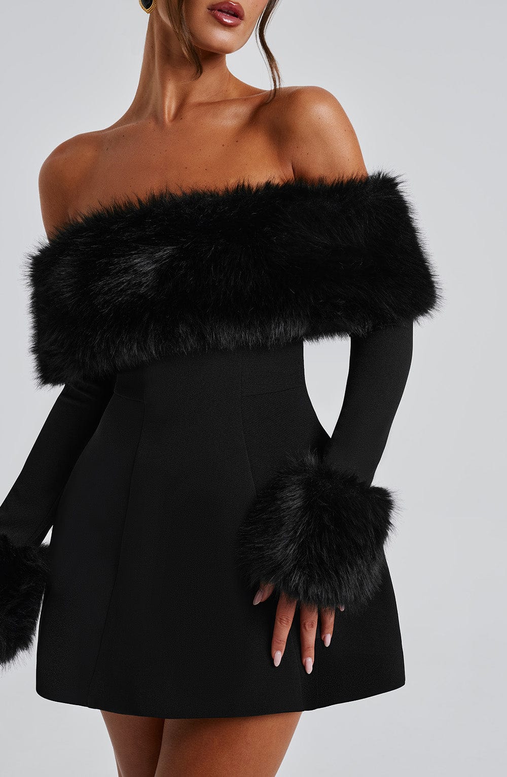 Long sleeve black mini dress with faux fur trim neckline and cuffs - view 2