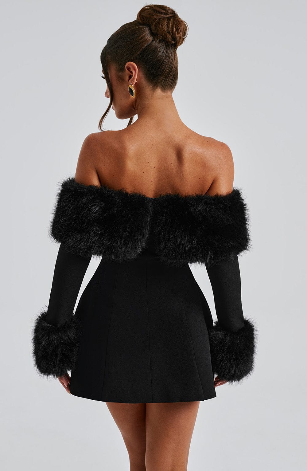 Long sleeve black mini dress with faux fur trim neckline and cuffs - view 3