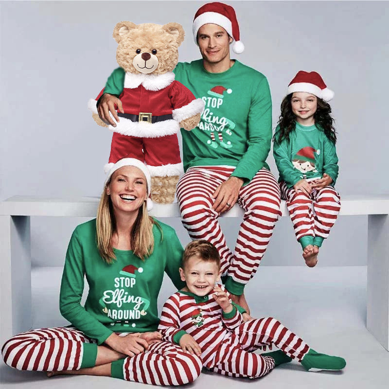 Family holiday pajamas with green elf print tops and red and white striped pants - view 2