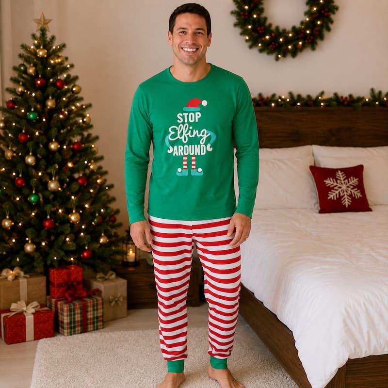 Family holiday pajamas with green elf print tops and red and white striped pants - view 3