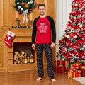 Holiday pajamas family set with red raglan slogan tee and black candy cane pajama pants - view 3
