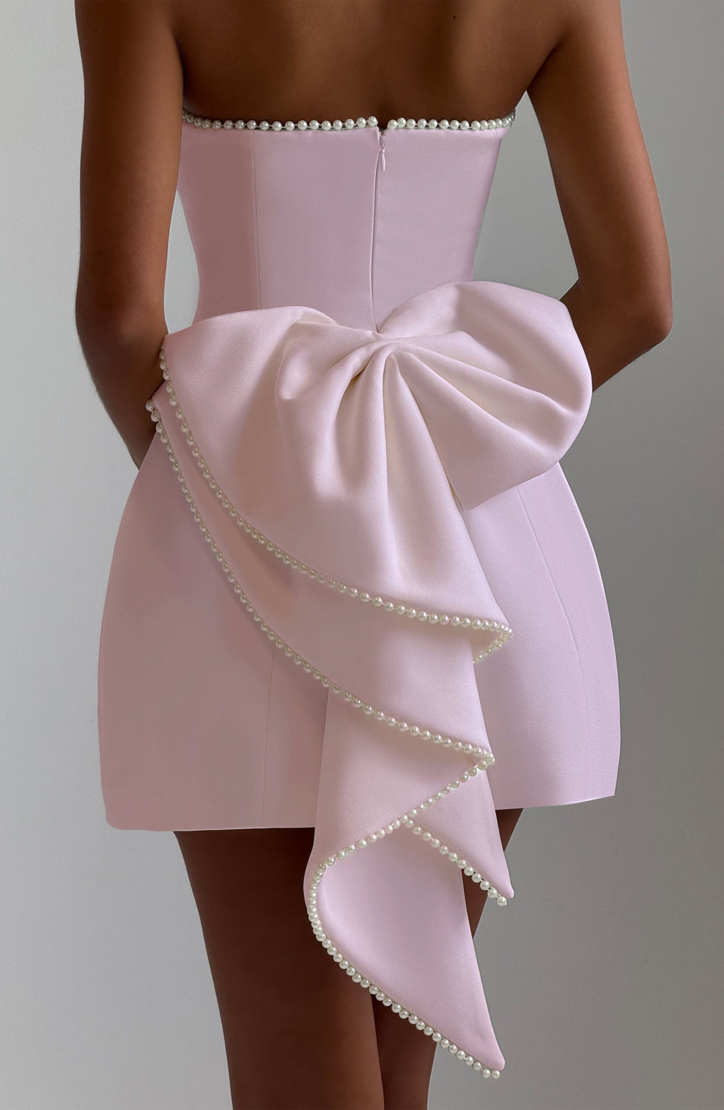 Formal strapless mini dress with pearl-edged sculptural bow at the back - view 2