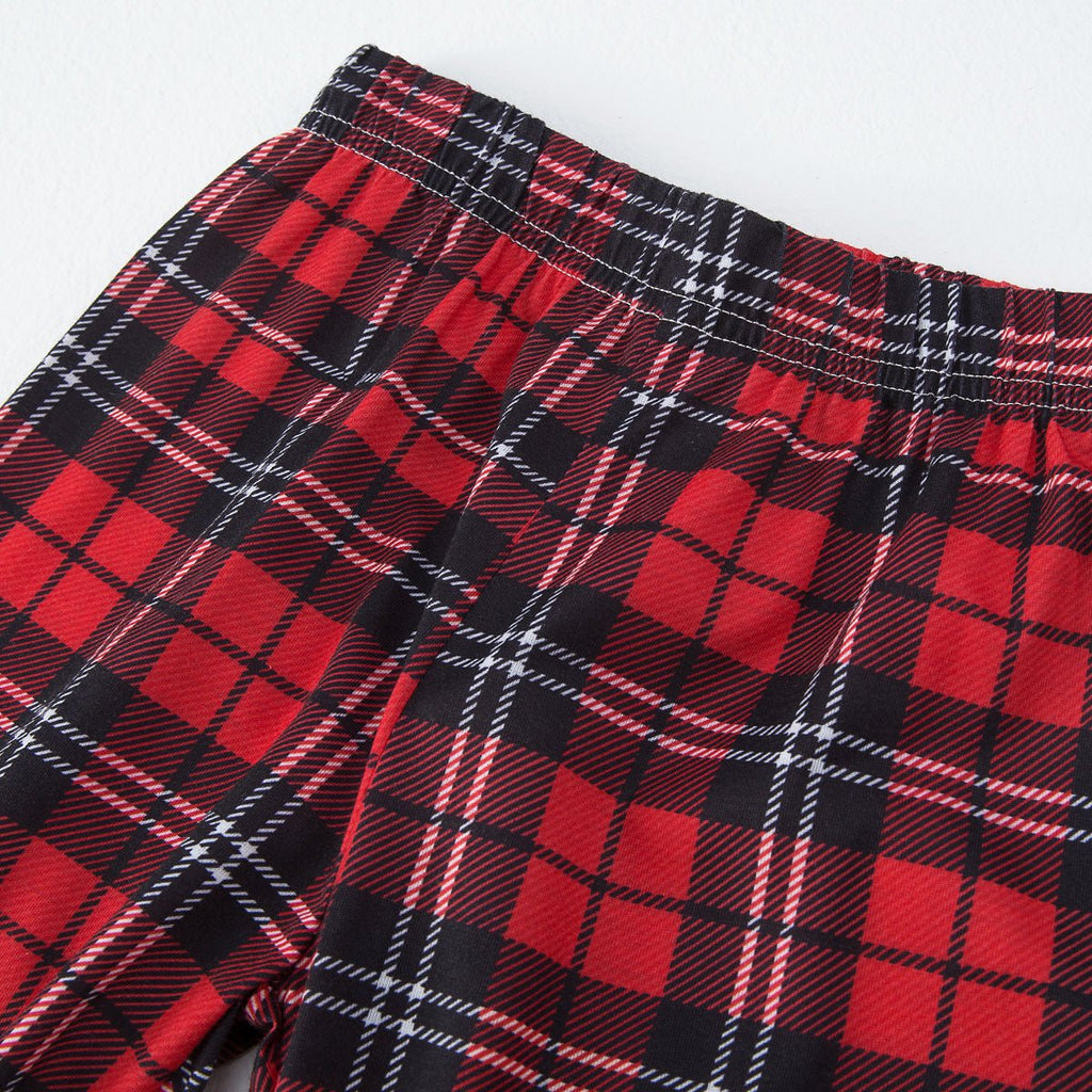 Matching family Christmas pajamas with red truck graphic raglan top and red plaid pants - view 10