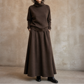Woman wearing a brown turtleneck sweater and matching maxi skirt set - view 15
