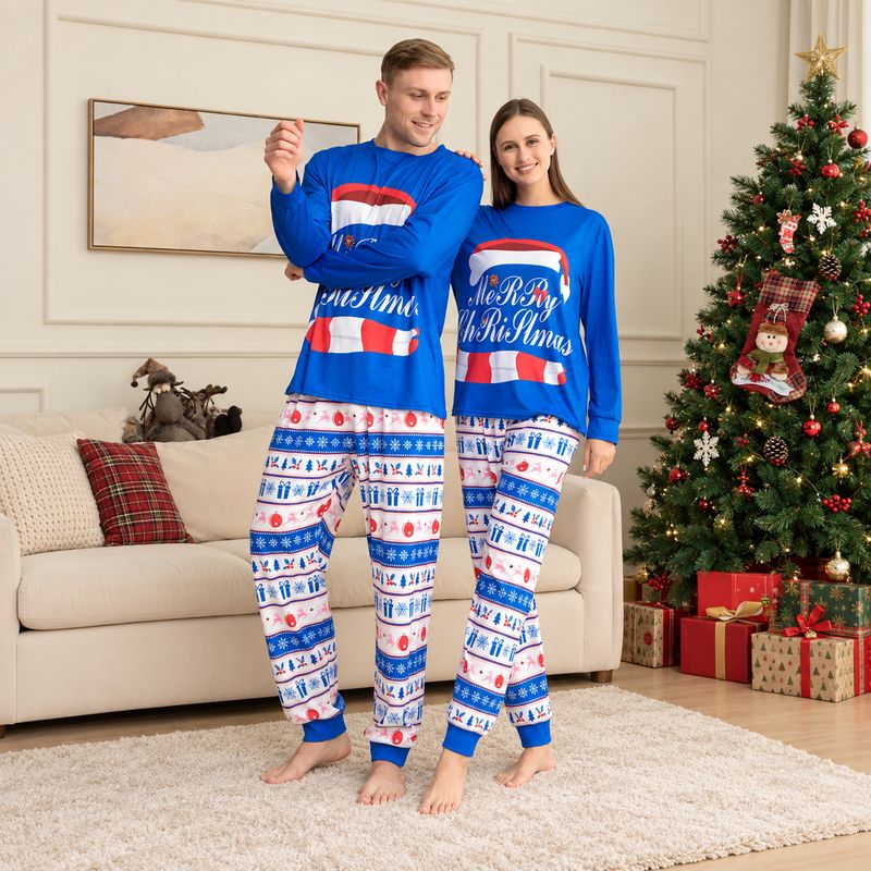 Matching holiday pajama set with blue Merry Christmas top and festive print pants - view 2
