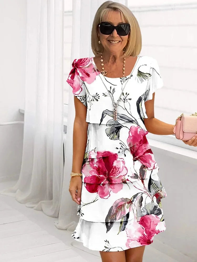 Tiered flutter sleeve party dress with scoop neck in a printed design