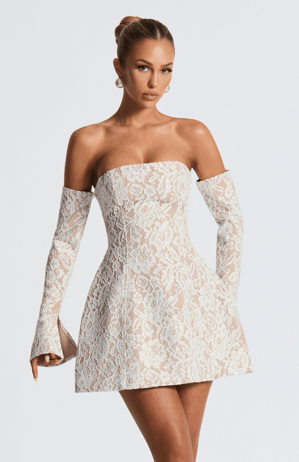 Strapless white lace mini dress over nude lining with separate long flared lace sleeves and lace-up back - view 5