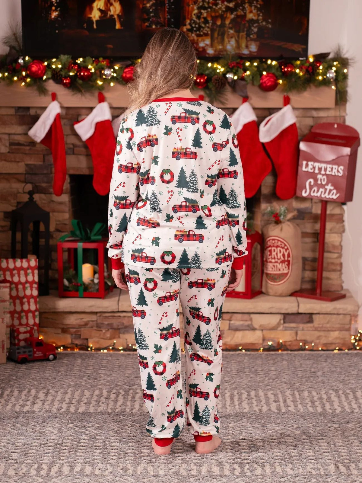 Family matching Christmas pajamas with plaid truck, tree and wreath print and red cuffs - view 10
