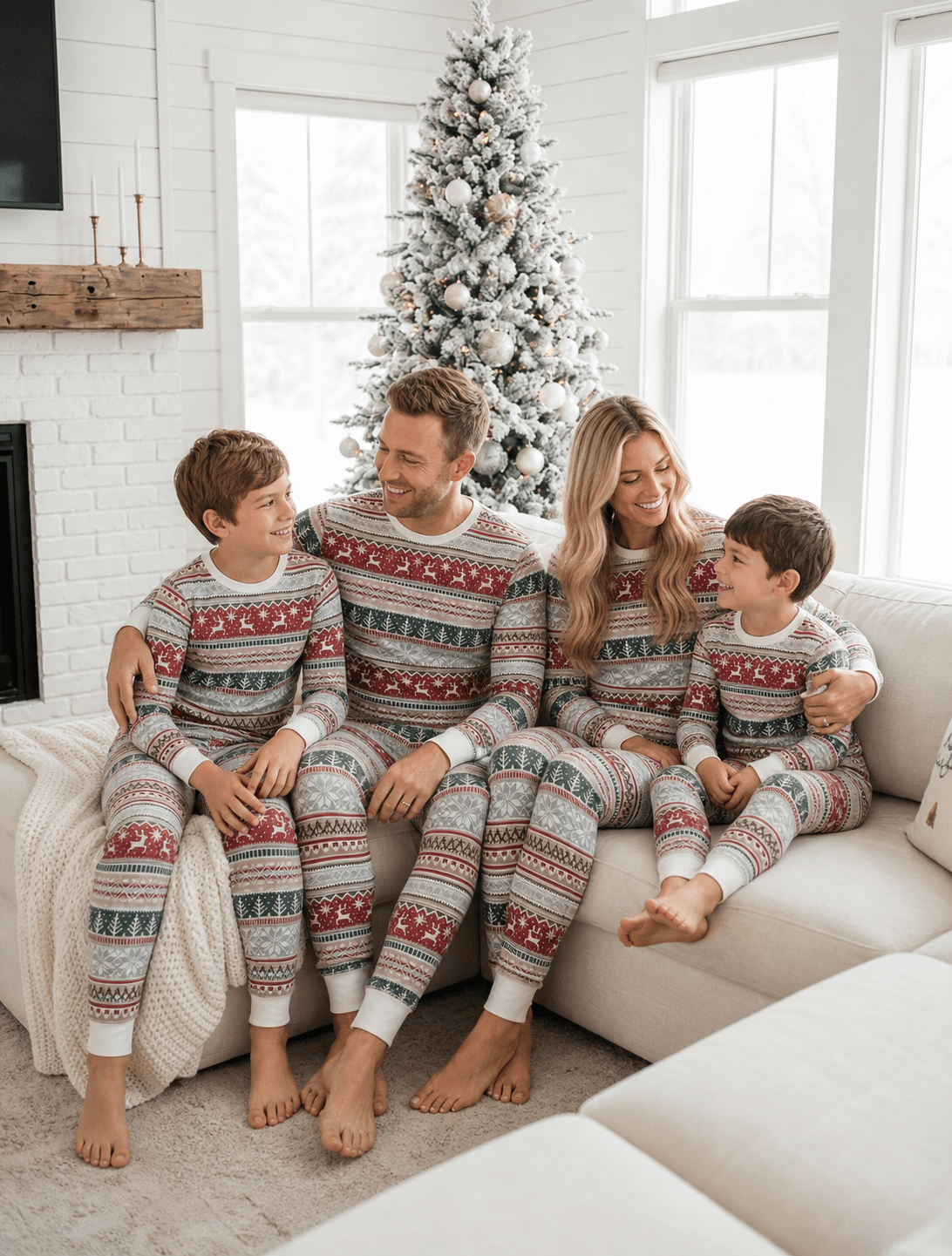 Family wearing matching Fair Isle Christmas pajamas with reindeer print and white cuffs - view 4