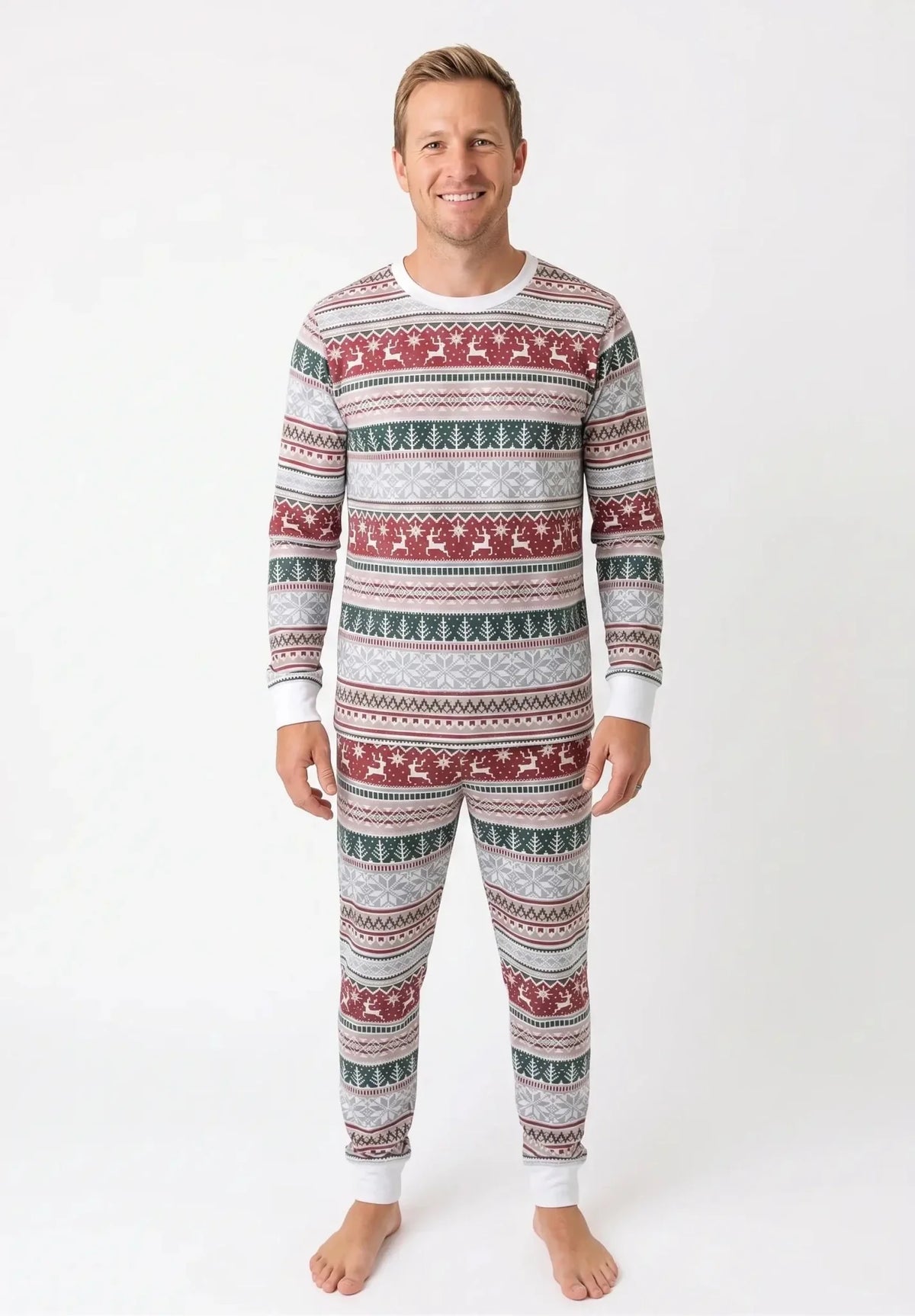 Family wearing matching Fair Isle Christmas pajamas with reindeer and snowflake print and white cuffs - view 8