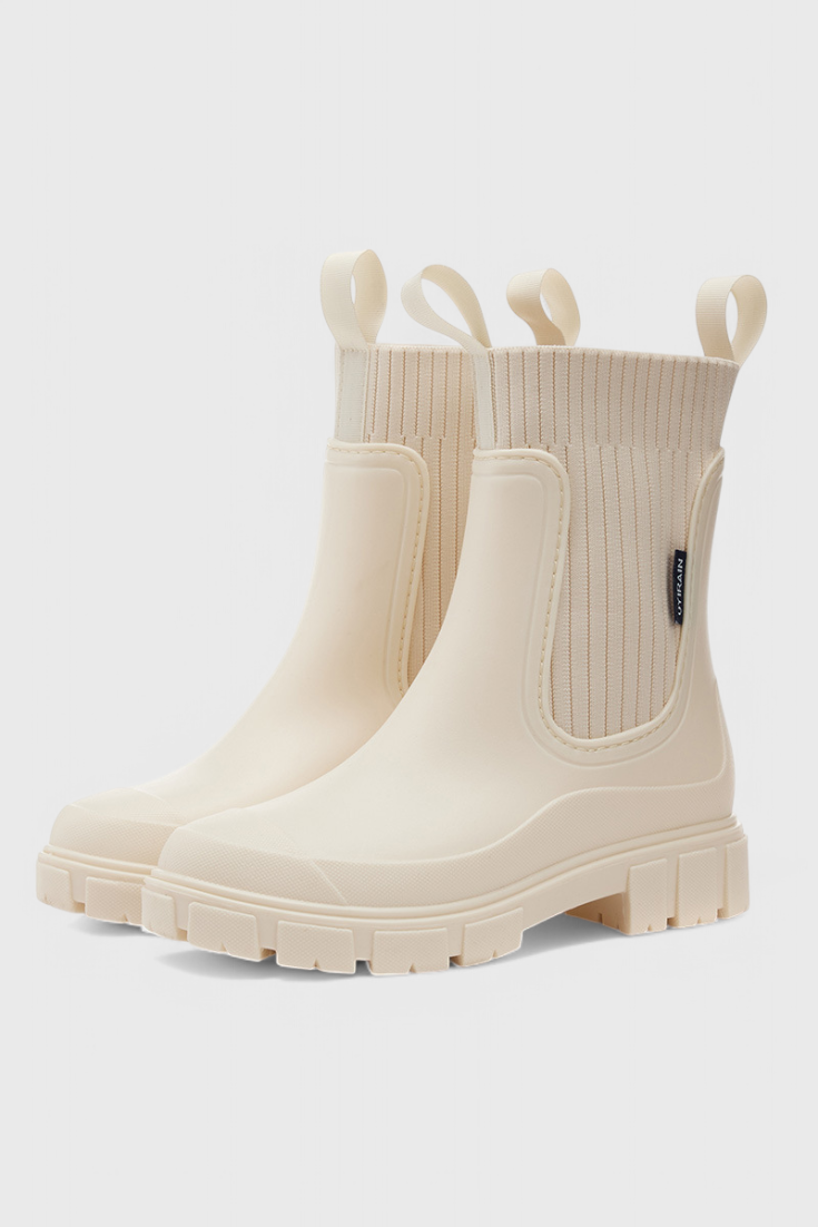 Lug sole Chelsea boots for women with tall ribbed knit collar and pull tabs