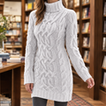 Woman wearing cable knit turtleneck sweater dress with long sleeves