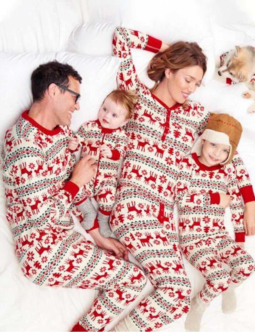 Family wearing matching red and cream reindeer print Christmas pajamas - view 2