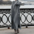 Oversized knit maxi sweater dress with long sleeves and front patch pockets
