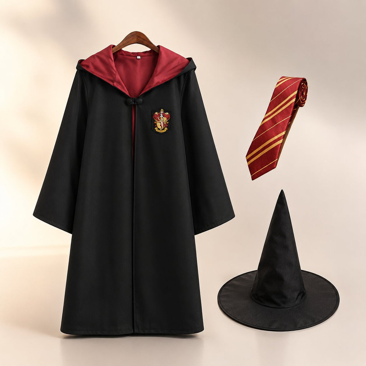 Black hooded wizard robe with contrast house-color hood and crest patch