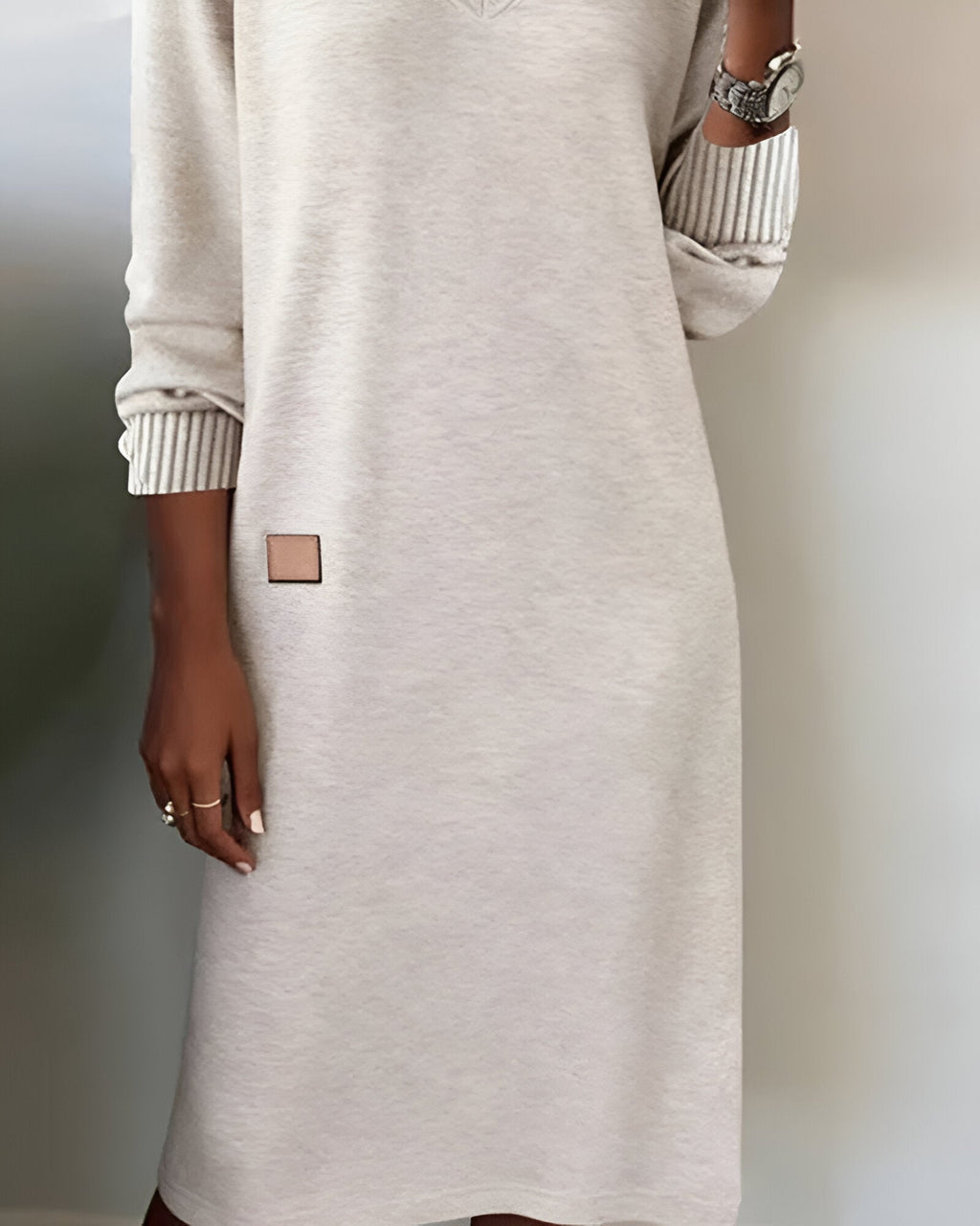 Woman wearing a V-neck long sleeve midi sweater dress with ribbed cuffs - view 7