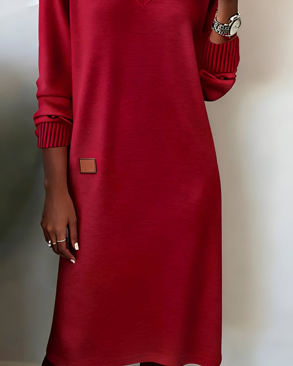 Woman wearing a V-neck long sleeve midi sweater dress with ribbed cuffs - view 9