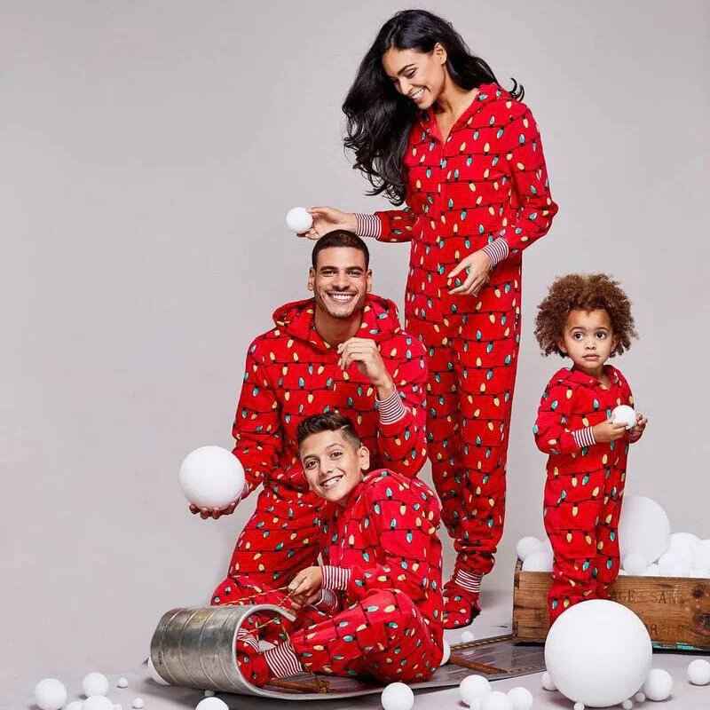 Matching family in red hooded Christmas pajama onesies with light bulb print - view 2