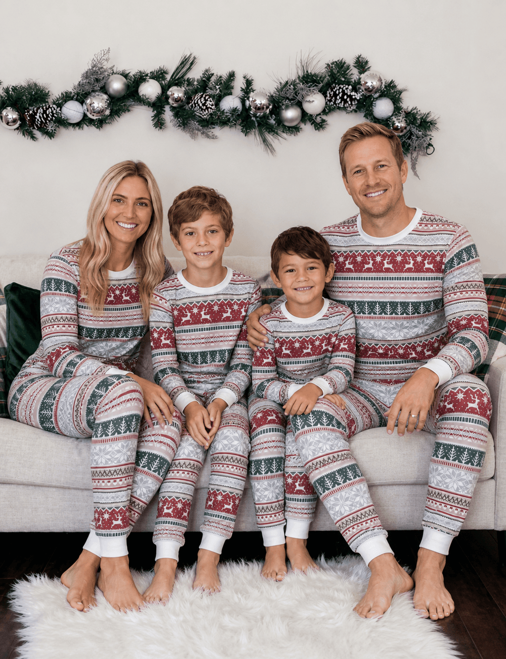 Family wearing matching Fair Isle reindeer print Christmas pajamas with white cuffs - view 13