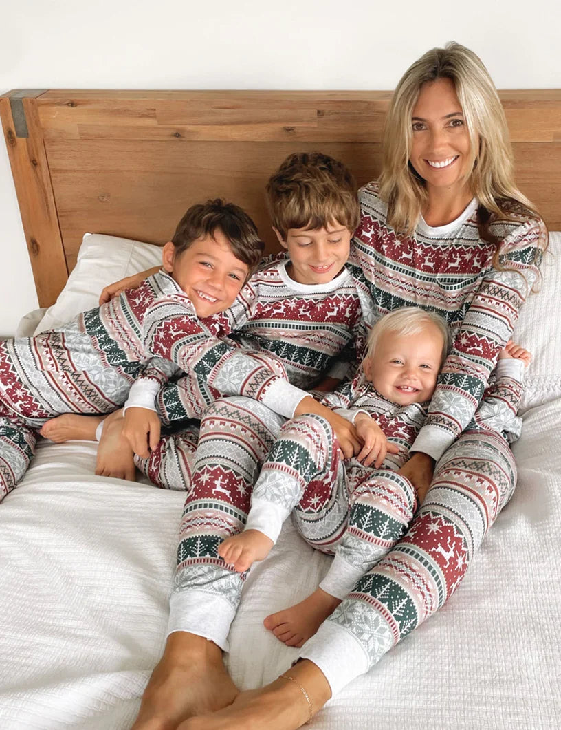 Family wearing matching Fair Isle reindeer print Christmas pajamas with white cuffs - view 3